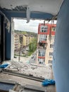 Irpen, Ukraine. May 07. 2022. View of a neighboring house from a ruined apartment through a hole from an explosion