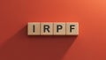IRPF text on wooden block.