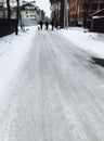 A group of men & dogs walk down the frozen streets of Irpen, Ukraine Royalty Free Stock Photo