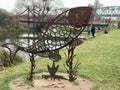 An iron fish on the boardwalk on the Irpin River Walk,