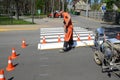 IRPIN, UKRAINE - MAY 06, 2017: Worker is painting a pedestrian crosswalk. Technical road man worker painting and remarking pedestr