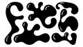 Irregular black organic blobs in various shapes creating a playful visual composition