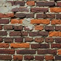 A mix of red and orange-brown bricks, displaying varying texture and Royalty Free Stock Photo