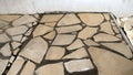 Irregular natural stone flooring installation construction work Royalty Free Stock Photo
