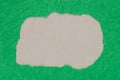 Irregular shape hole on piece on green paper