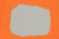 Irregular shape hole on piece on orange paper