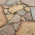 Irregularly shaped flagstones create a mosaic-like pattern on a pathway Royalty Free Stock Photo