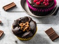 Irresistible Chocolate Delight: Chocolate-covered Cupcake with Rich Topping