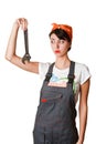 Irresolute girl with spanner Royalty Free Stock Photo