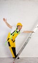 Irresponsible use of a ladder during construction work. Royalty Free Stock Photo