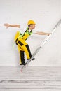 Irresponsible use of a ladder during construction work. Royalty Free Stock Photo