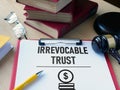 Irrevocable trust document is shown using the text Royalty Free Stock Photo