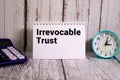 Irrevocable trust document with text on wooden background