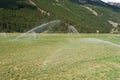 Irrigating field on summer Royalty Free Stock Photo