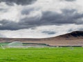 Irrigating lush farm pastures in central Otago NZ Royalty Free Stock Photo