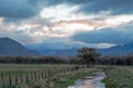 Irrigation canal running through cattle ranch during early morning sunrise just east of drought stricken Lake Isabella in Californ