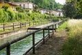 An irrigation canal wends its way through italy farmland .