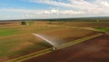 Aerial view:Irrigation system watering a farm field. Royalty Free Stock Photo