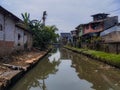 irrigation river in the urban settlements of Jakarta Royalty Free Stock Photo