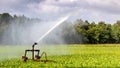 Irrigation system watering farm crops Royalty Free Stock Photo