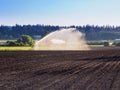 Irrigation system watering freshly seeded field Royalty Free Stock Photo