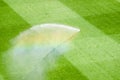 Irrigation turf in a stadium at daytime Royalty Free Stock Photo