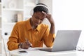 Irritated african american woman attending video conference Royalty Free Stock Photo