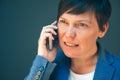 Irritated angry business woman during mobile phone conversation Royalty Free Stock Photo
