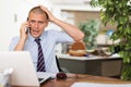 Irritated businessman having difficult phone talk