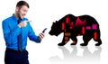 Irritated businessman holding smartphone near silhouette of bear. Royalty Free Stock Photo