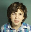 Irritated confused teenager portrait close up
