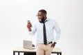 Irritated dark skinned young male enterpreneur being on working place feels very stressed and angry as cannot manage to Royalty Free Stock Photo