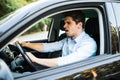 An irritated young man driving a vehicle is expressing his road rage Royalty Free Stock Photo