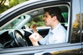 An irritated young man driving a vehicle is expressing his road rage Royalty Free Stock Photo