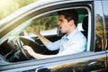 An irritated young man driving a vehicle is expressing his road rage Royalty Free Stock Photo