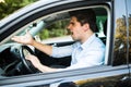 An irritated young man driving a vehicle is expressing his road rage Royalty Free Stock Photo