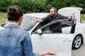irritated man screaming on driver on road after Royalty Free Stock Photo