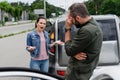 irritated woman screaming on driver on road after Royalty Free Stock Photo