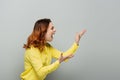 irritated woman in yellow shirt shouting