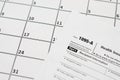 IRS Form 1095-A Health Insurance Marketplace Statement tax blank lies on empty calendar page