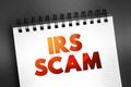 IRS Scam text quote on notepad, concept background Royalty Free Stock Photo