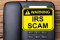 IRS Scam Warning Sign On Landline Phone Royalty Free Stock Photo
