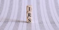 IRS word on a wooden cubes on the chart background Royalty Free Stock Photo