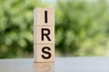 IRS word written on wooden cubes on table with green background Royalty Free Stock Photo