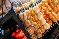 Isaan sausage being grilled on the traditional stove that be a part of street food in Thailand