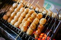 Isaan sausage being grilled on the traditional stove that be a part of street food in Thailand