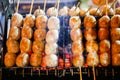 Isaan sausage being grilled on the traditional stove that be a part of street food in Thailand