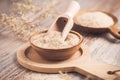 Isabgol - heap of psyllium husk in wooden bowl on wooden table table Royalty Free Stock Photo