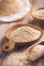 Isabgol - heap of psyllium husk in wooden bowl on wooden table table Royalty Free Stock Photo