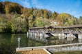 Isar river and weir, Kastenmuhlwehr, tourist destination Wolfratshausen in autumn